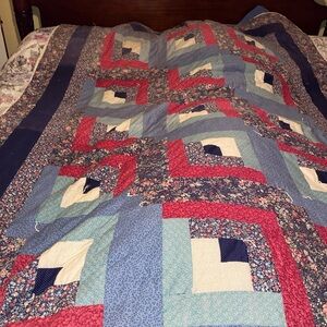 Patchwork Quilt with Blue and Red Accents
